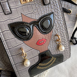 designer top handle faux leather handbag