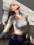 cut out shoulder long sleeve cropped top
