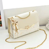 ribbon with pearl tassel square chained crossbody bag